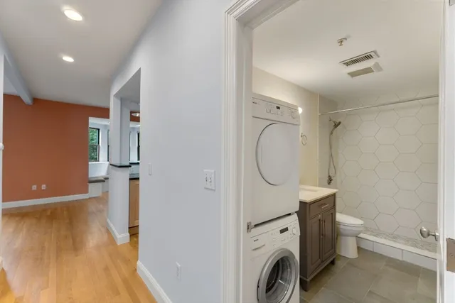 a view of a storage & utility room with a washer dryer