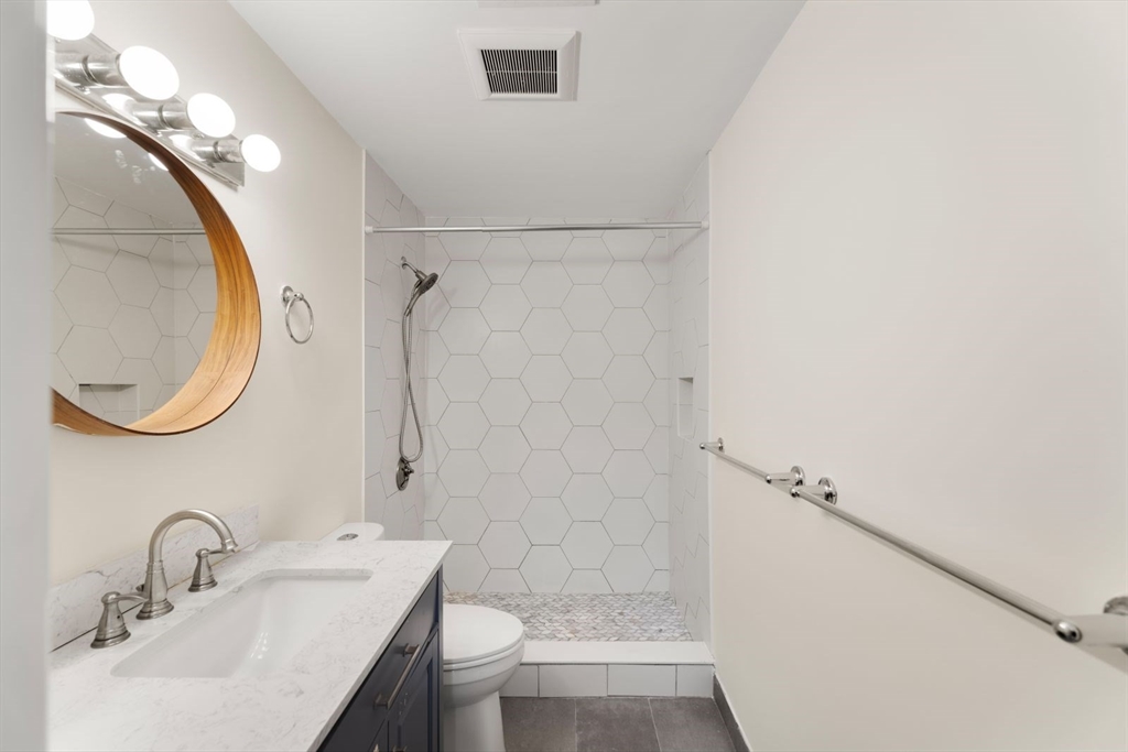 39 Worcester Square, Unit PH 5 Boston, MA 02118 - Photo 16 of 20 a bathroom with a sink a toilet and shower