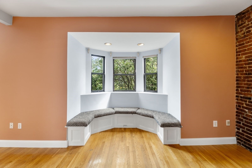 39 Worcester Square, Unit PH 5 Boston, MA 02118 - Photo 3 of 20 a view of a bedroom with a bed and wooden floor