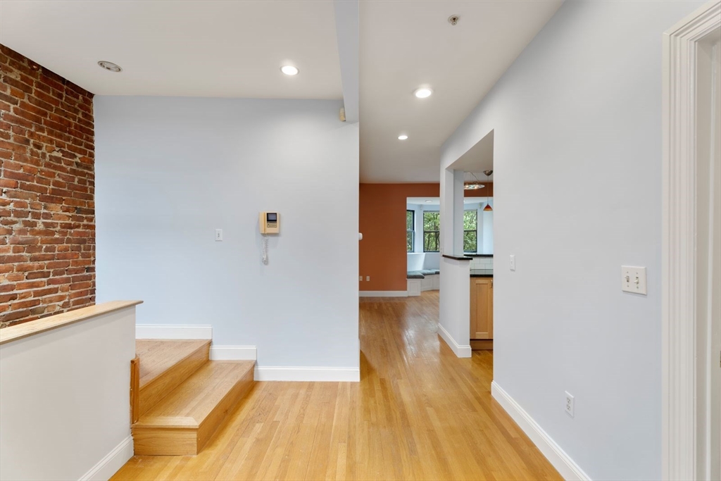39 Worcester Square, Unit PH 5 Boston, MA 02118 - Photo 10 of 20 a view of a room with wooden floor and a bathroom