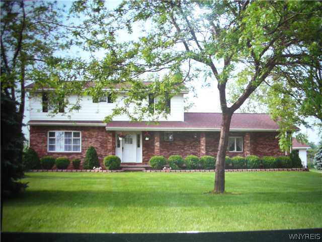 6995 Dysinger Road Lockport Town, NY 14094 - Photo 1 of 1 Exterior Front. brick front with huge porch and pl