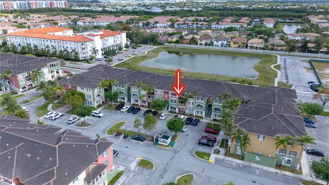 an aerial view of a house with a swimming pool a yard and outdoor seating