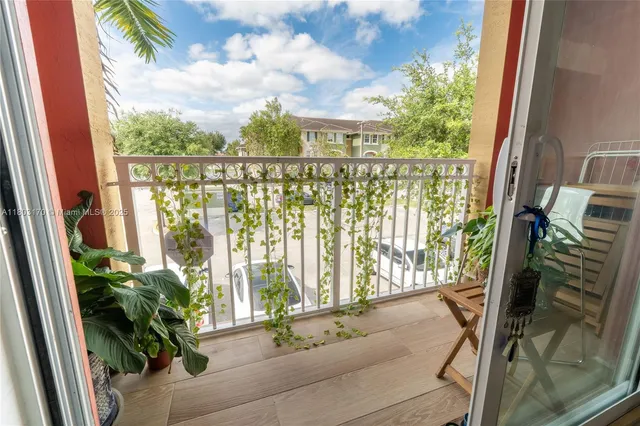 a view of balcony with furniture