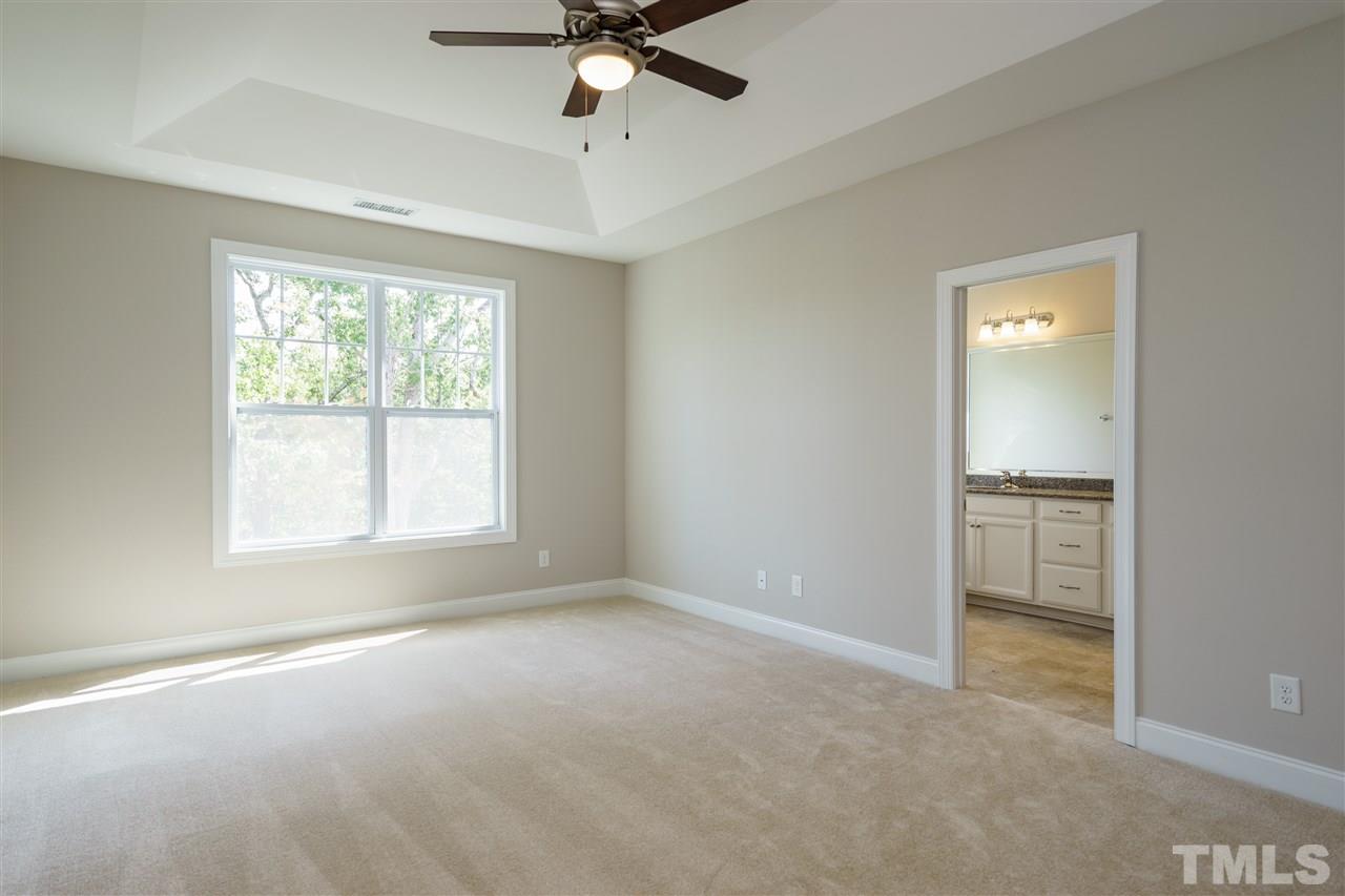318 Roberts Ridge Drive Cary, NC 27513 - Photo 7 of 18 a view of an empty room with a window