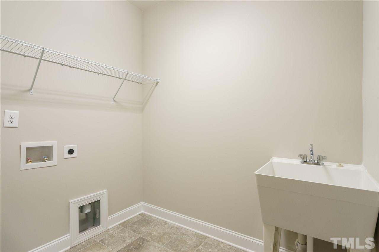 318 Roberts Ridge Drive Cary, NC 27513 - Photo 8 of 18 a bathroom with a sink and vanity