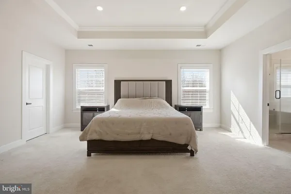 a bedroom with bed and a window
