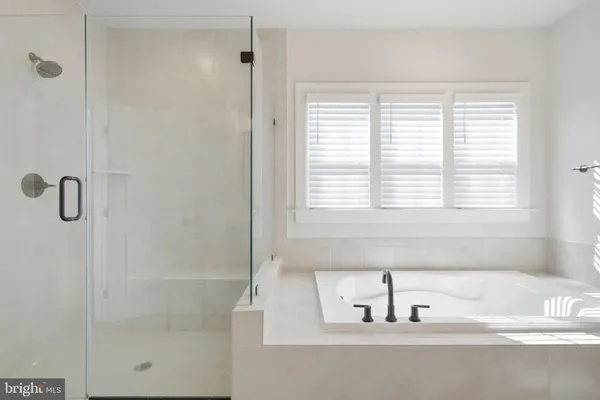 a bathroom with a sink toilet and a mirror
