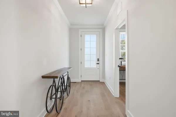 a view of a dining area with furniture and wooden floor
