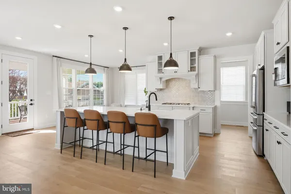 a dining room with furniture and a window