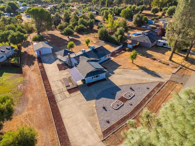 an aerial view of residential houses with outdoor space