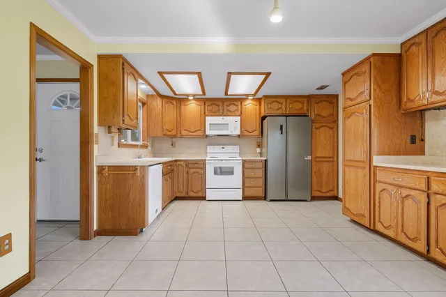 a kitchen with stainless steel appliances a refrigerator and a stove