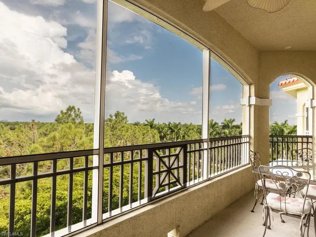 a kitchen with granite countertop a stove a sink dishwasher and a microwave oven with cabinets