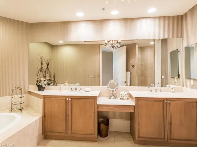 a bathroom with a sink double vanity and a mirror
