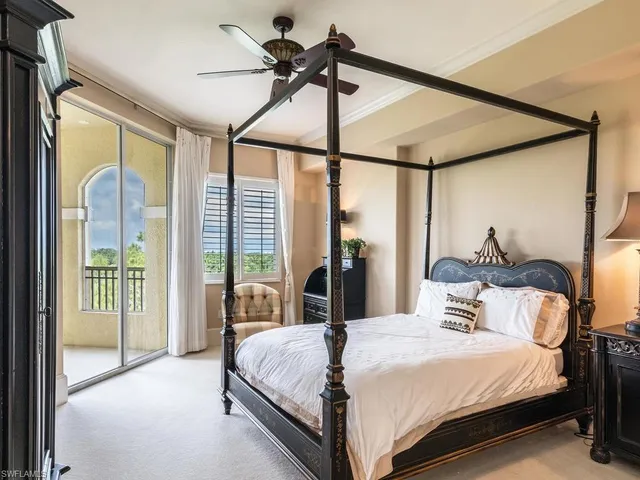 a utility room with stainless steel appliances white cabinets and a sink