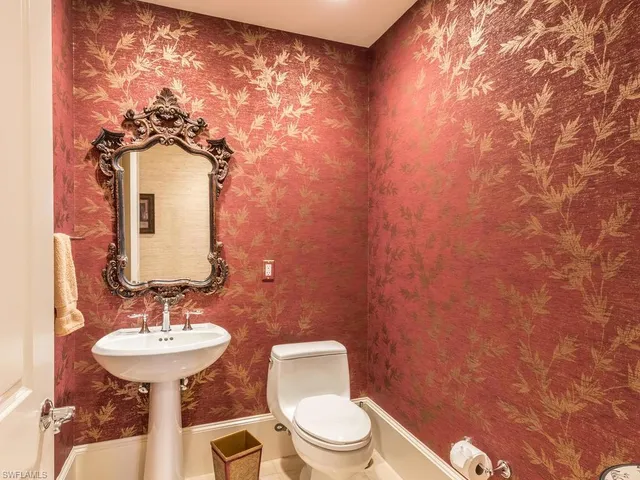 a balcony with furniture and a large window