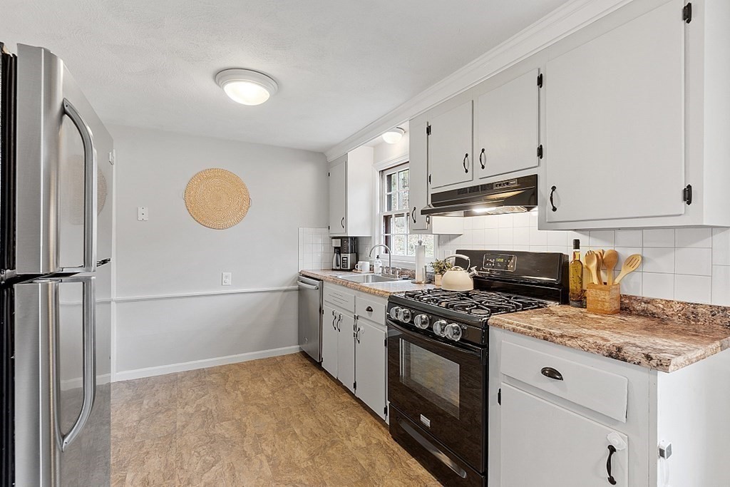19 Rack Road Chelmsford, MA 01824 - Photo 11 of 37 a kitchen with a stove a sink and a refrigerator