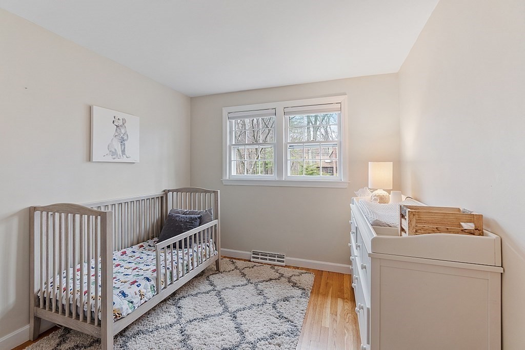19 Rack Road Chelmsford, MA 01824 - Photo 27 of 37 a bedroom with furniture and baby crib