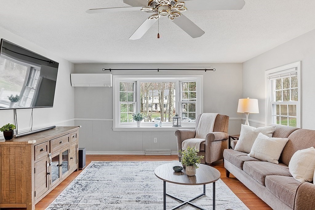 19 Rack Road Chelmsford, MA 01824 - Photo 6 of 37 a living room with furniture and a flat screen tv