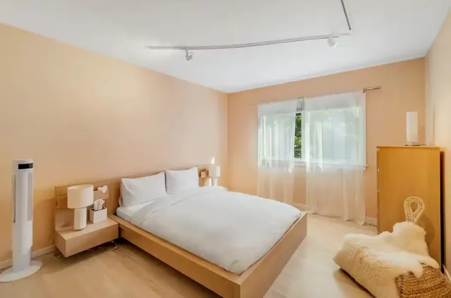 a bedroom with a bed and a couch