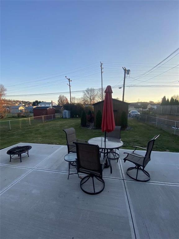 344 Spring Valley Road Pittsburgh, PA 15243 - Photo 8 of 10 a view of a patio with a table chairs and a yard