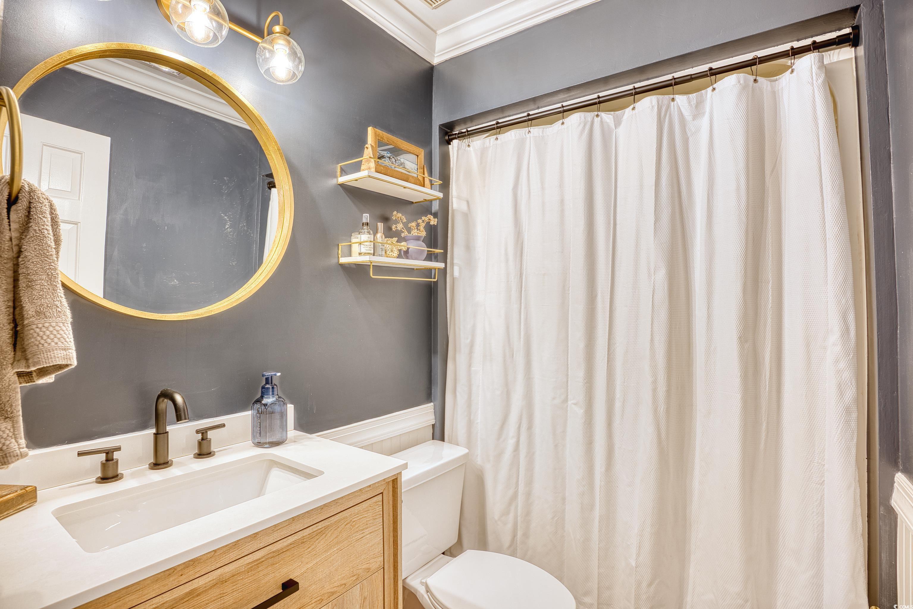 752 Kittiwake Lane Murrells Inlet, SC 29576 - Photo 26 of 35 Bathroom with vanity, toilet, and crown molding