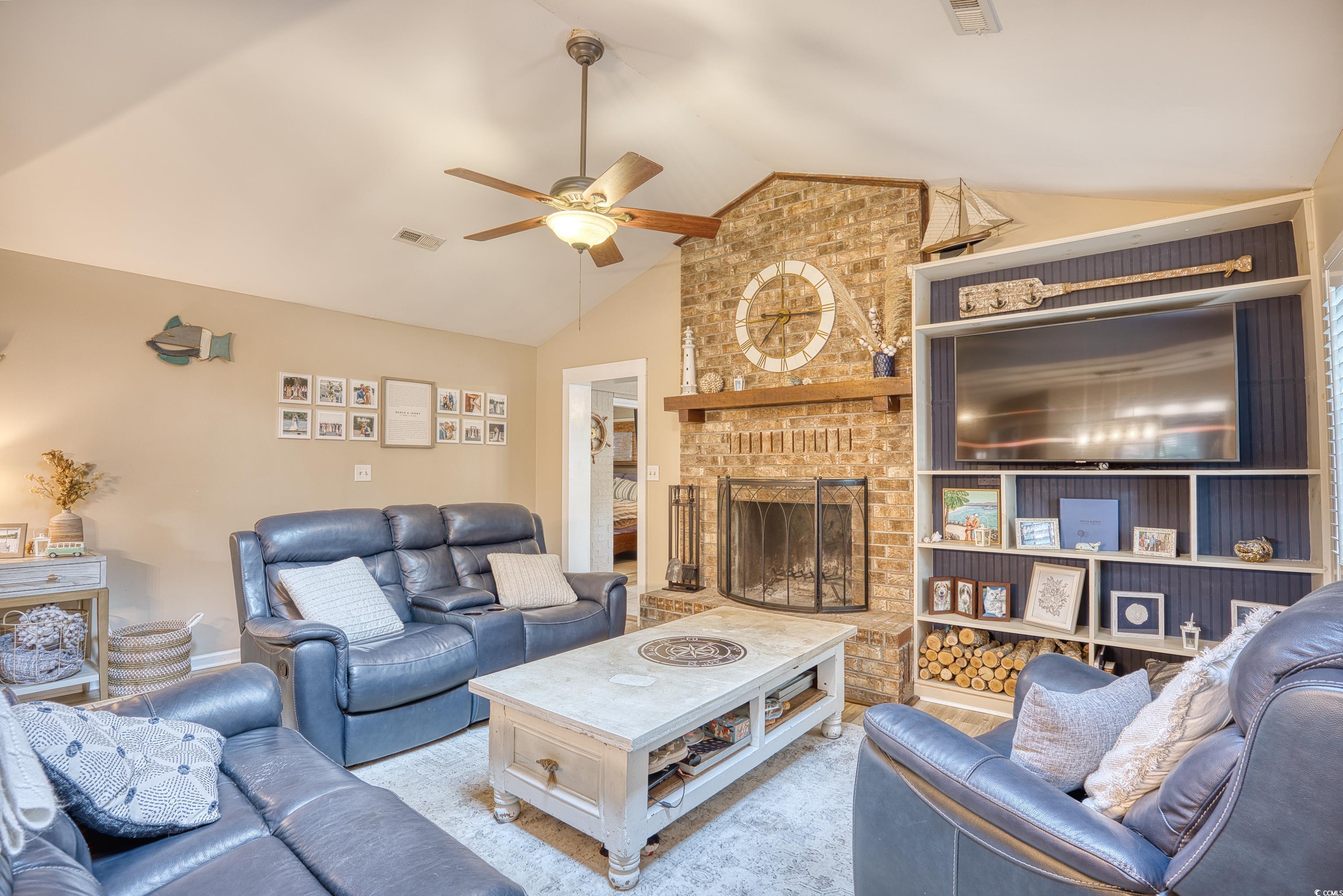 752 Kittiwake Lane Murrells Inlet, SC 29576 - Photo 4 of 35 Gorgeous living room with cozy wood fireplace