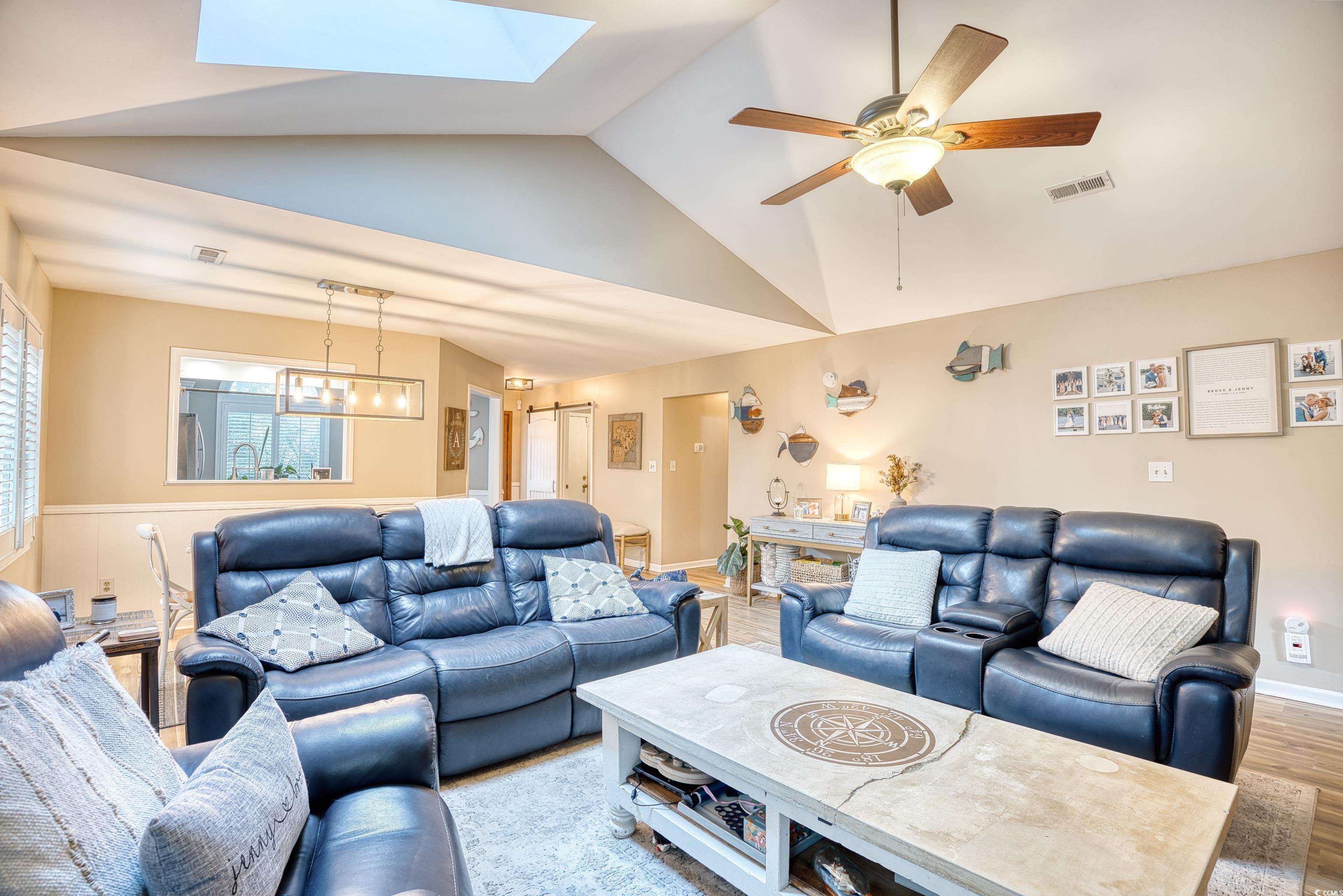752 Kittiwake Lane Murrells Inlet, SC 29576 - Photo 6 of 35 Living room with ceiling fan, vaulted ceiling with