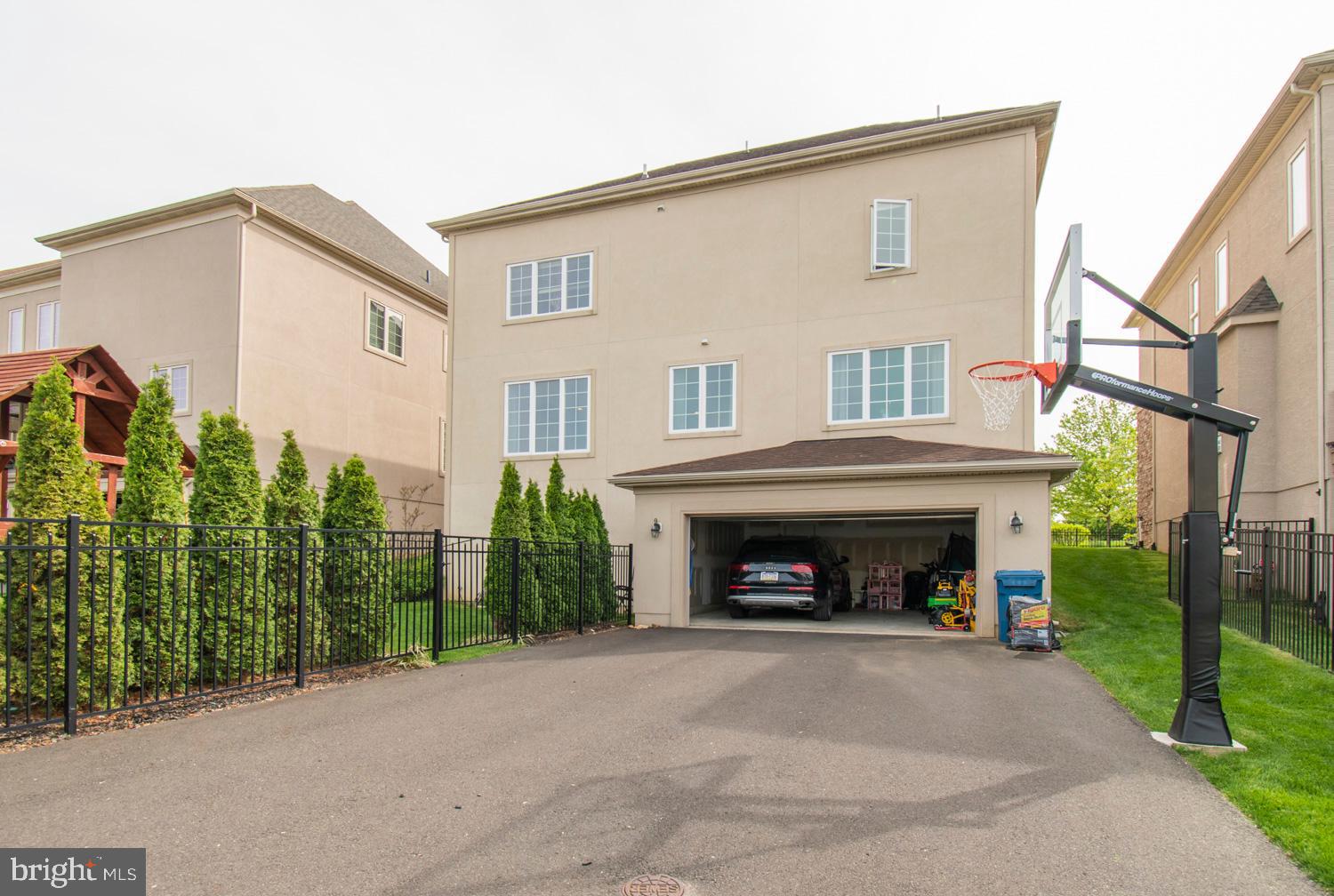 1647 Copper Beech Road Huntingdon Valley, PA 19006 - Photo 51 of 57 Rear of home with driveway and Basketball Court