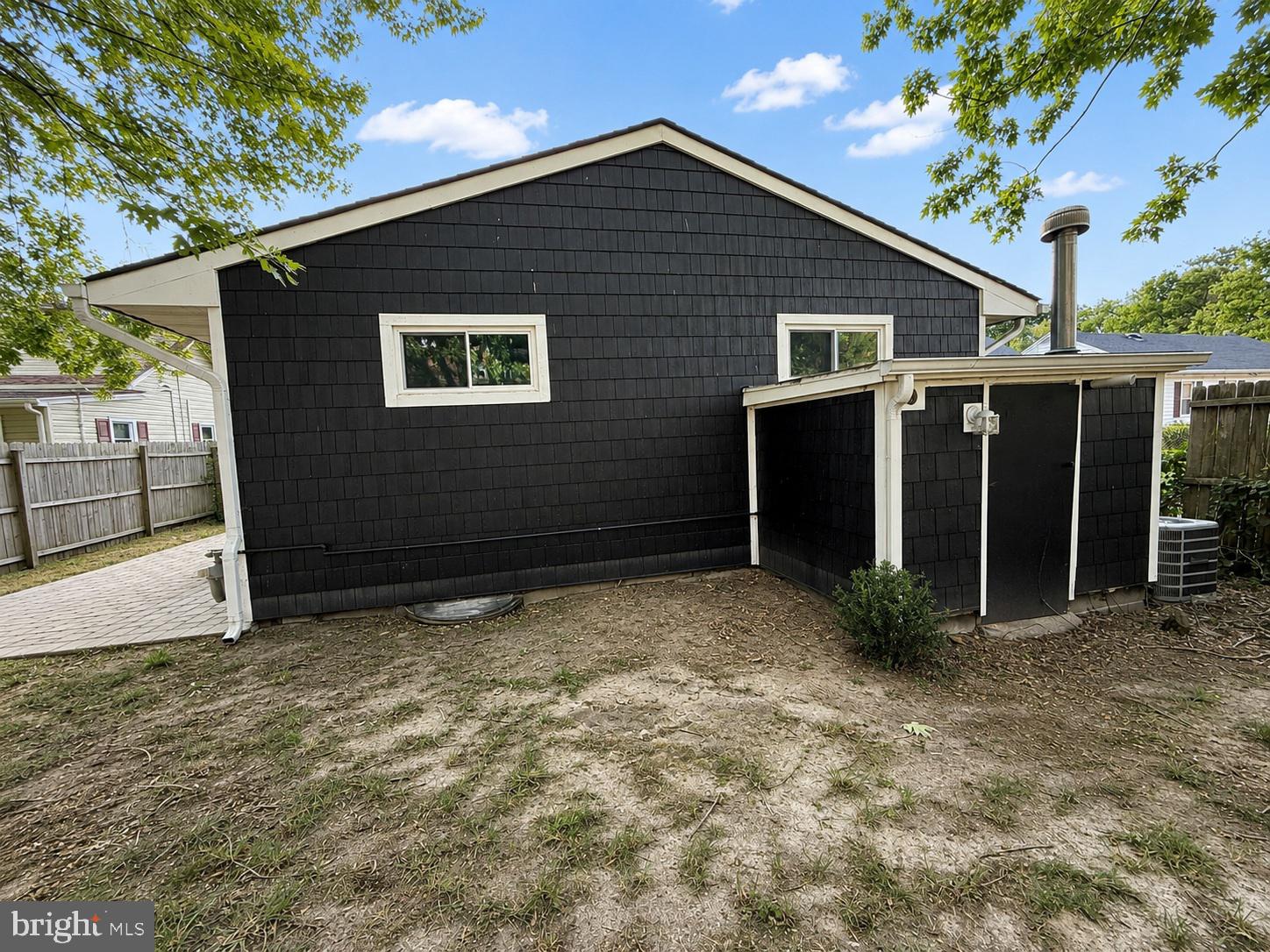 1021 Spring Avenue Salisbury, MD 21804 - Photo 6 of 6 Charming black exterior with greenery.