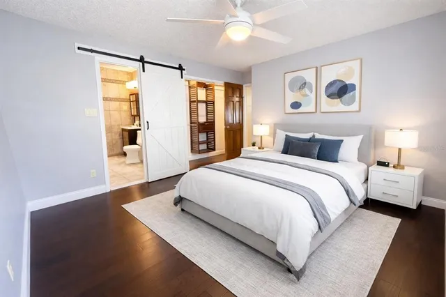 a bedroom with a large bed and a window