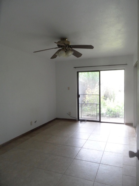 120 Peahi Road Haiku, HI 96708 - Photo 13 of 26 a view of a livingroom with a ceiling fan and window