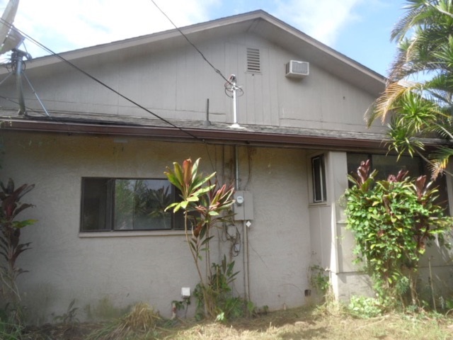 120 Peahi Road Haiku, HI 96708 - Photo 4 of 26 a house with a tree in front of it