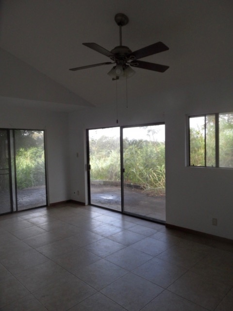 120 Peahi Road Haiku, HI 96708 - Photo 8 of 26 an empty room with windows and entrance