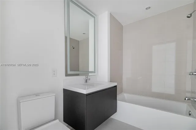 a view of empty room with windows