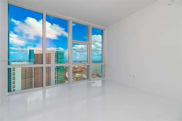 a view of a backyard with sitting area
