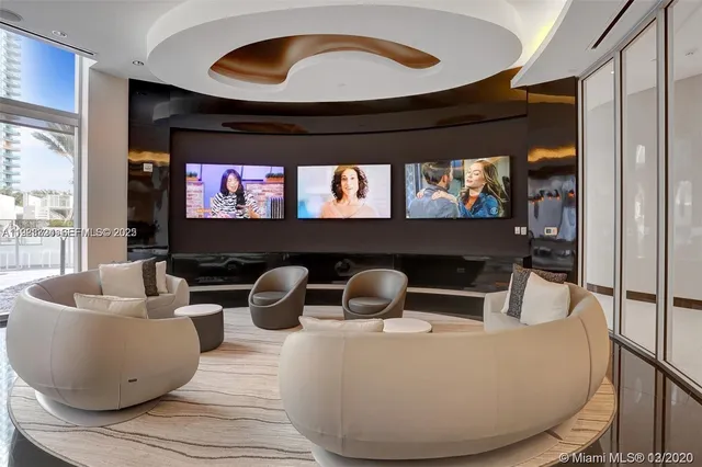 a view of a room with furniture and window