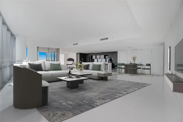 a bedroom with a large bed and a balcony