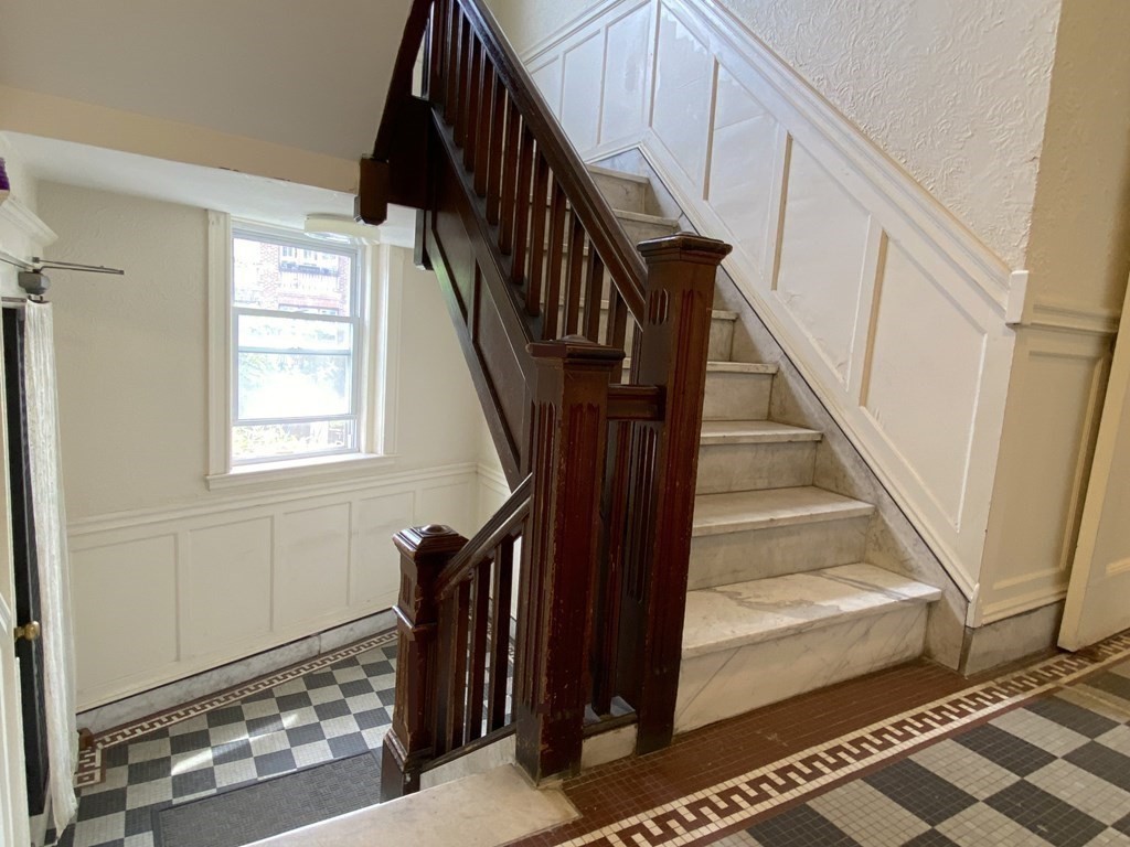 91 Bynner Street, Unit 1 Boston, MA 02130 - Photo 21 of 35 a view of staircase with wooden floor and windows