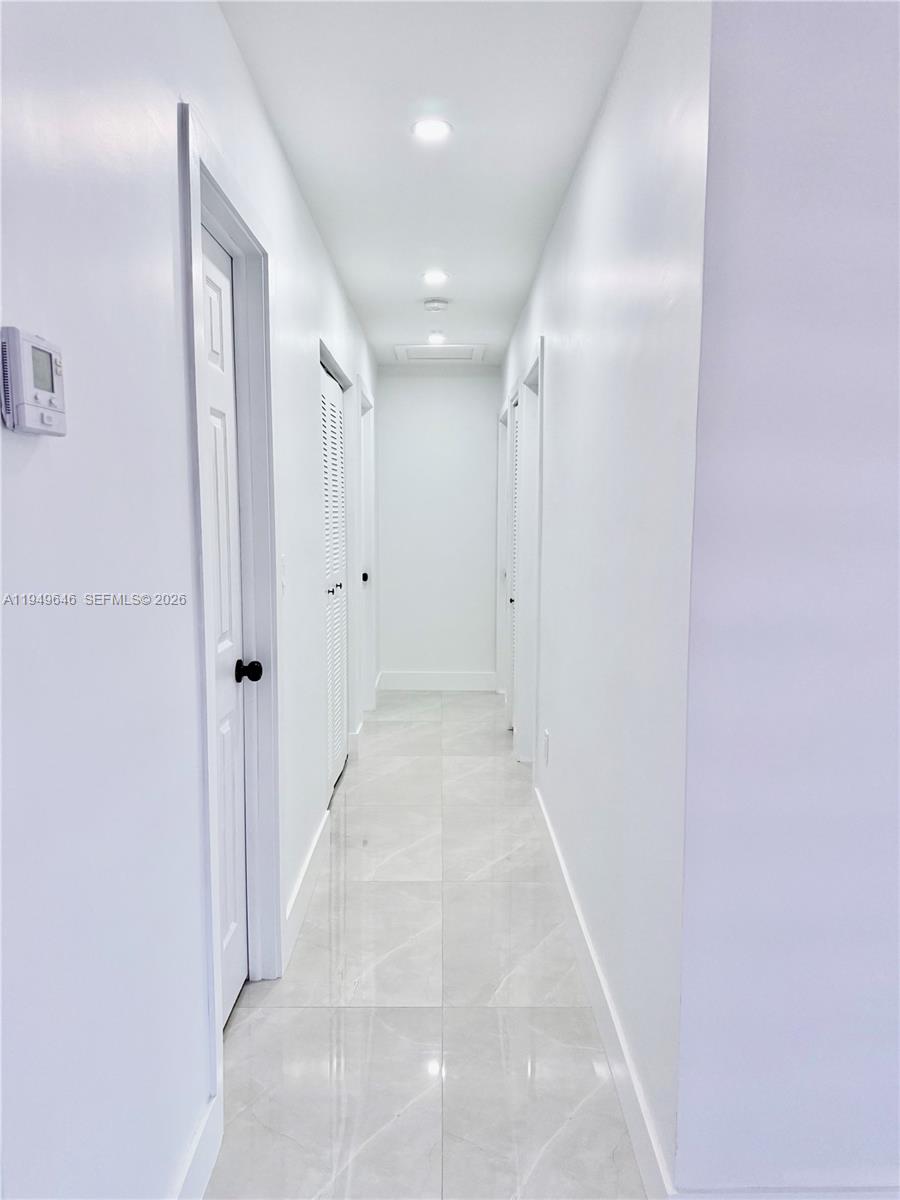 15235 Southwest 108th Court Miami, FL 33157 - Photo 15 of 25 a view of a hallway