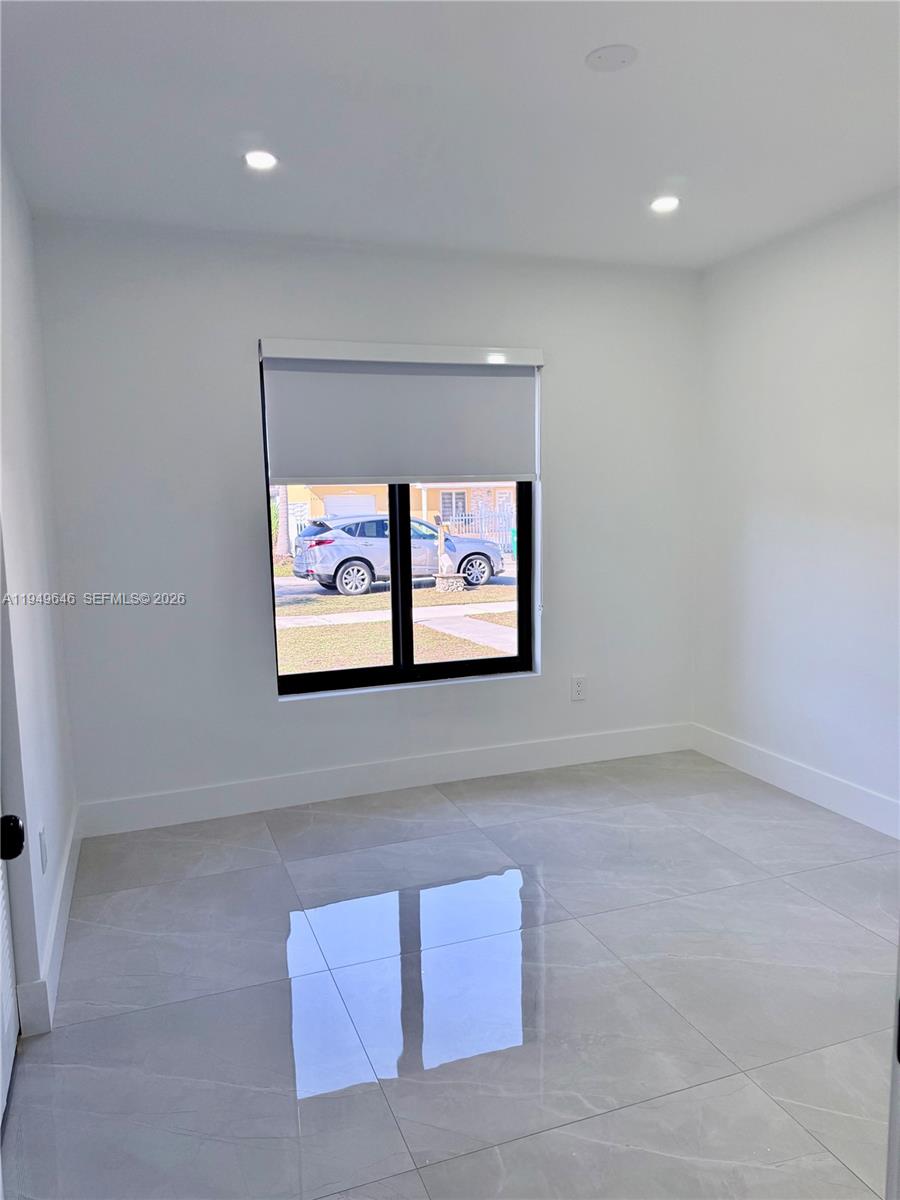 15235 Southwest 108th Court Miami, FL 33157 - Photo 16 of 25 a view of a hallway with painting on the wall
