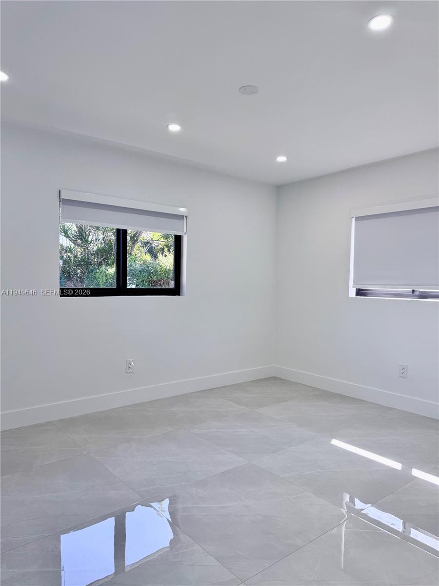 15235 Southwest 108th Court Miami, FL 33157 - Photo 21 of 25 a view of an empty room with a window