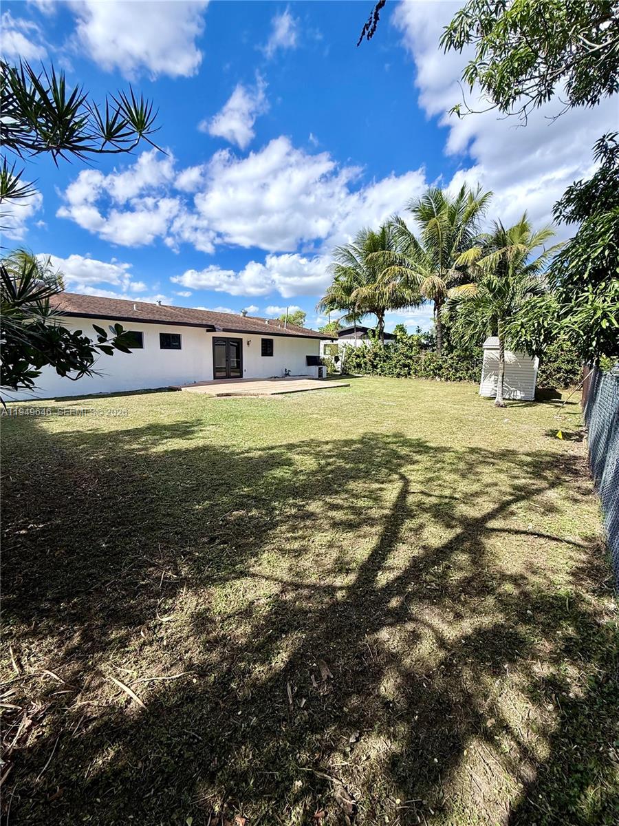 15235 Southwest 108th Court Miami, FL 33157 - Photo 25 of 25 a view of a big yard next to a house with a yard