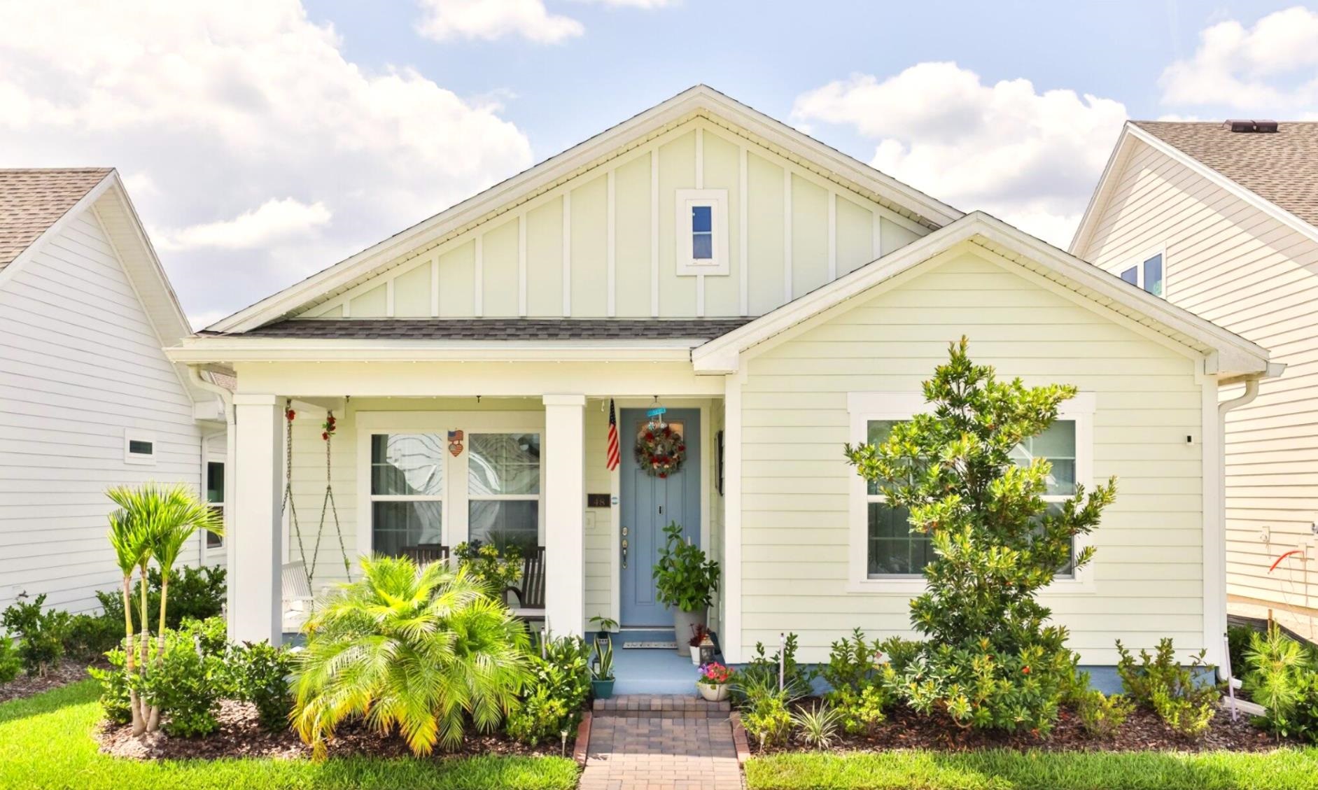 a front view of a house with garden