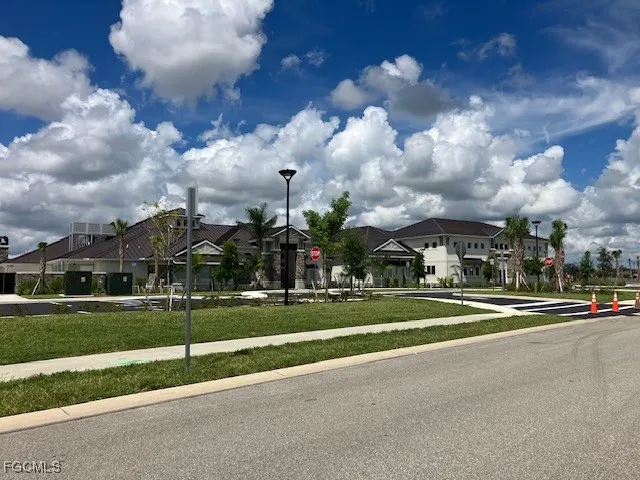 a living room with lots of furniture and a large window