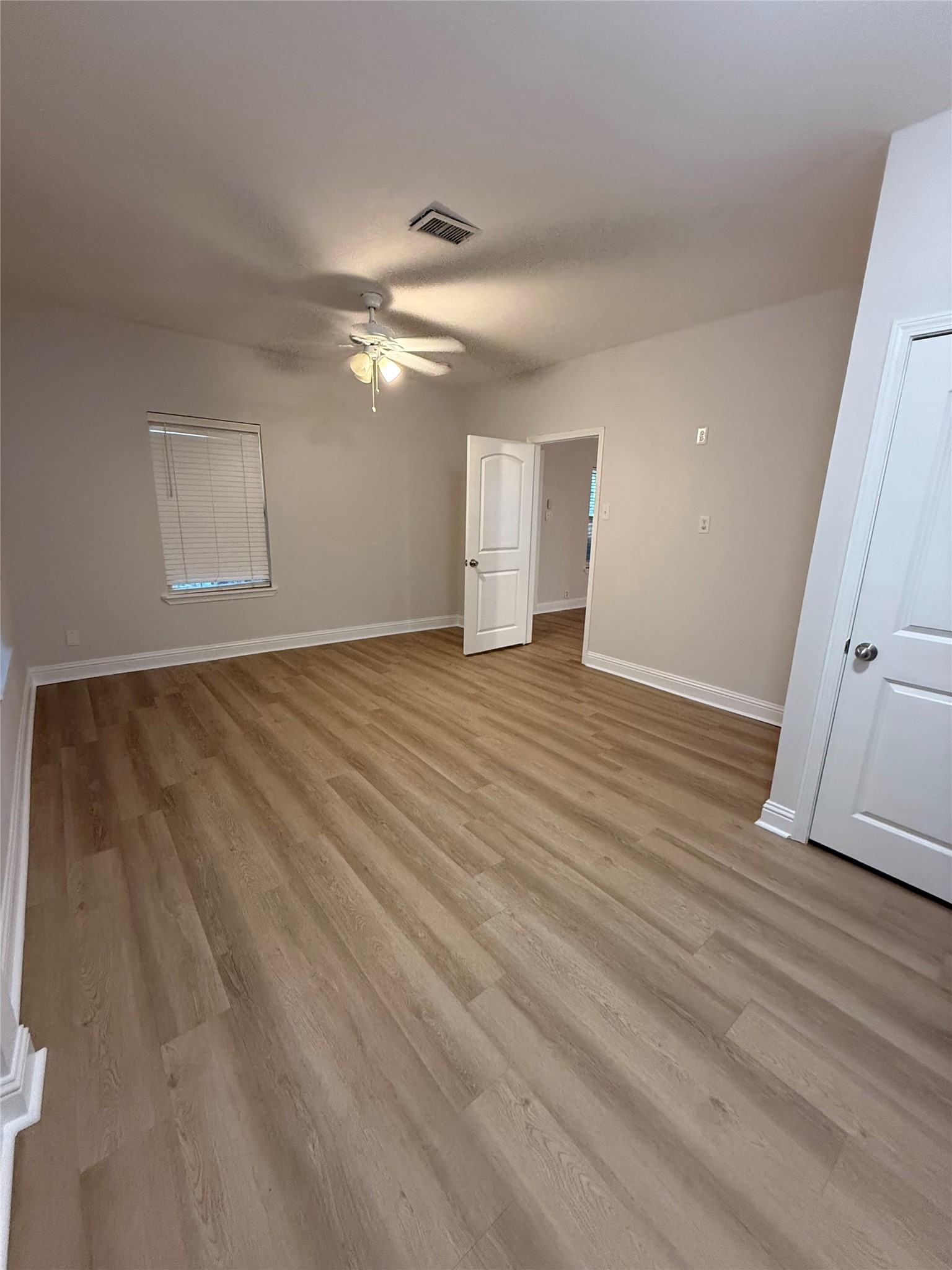 320 Delaware Street Houston, TX 77029 - Photo 8 of 10 a view of empty room with wooden floor