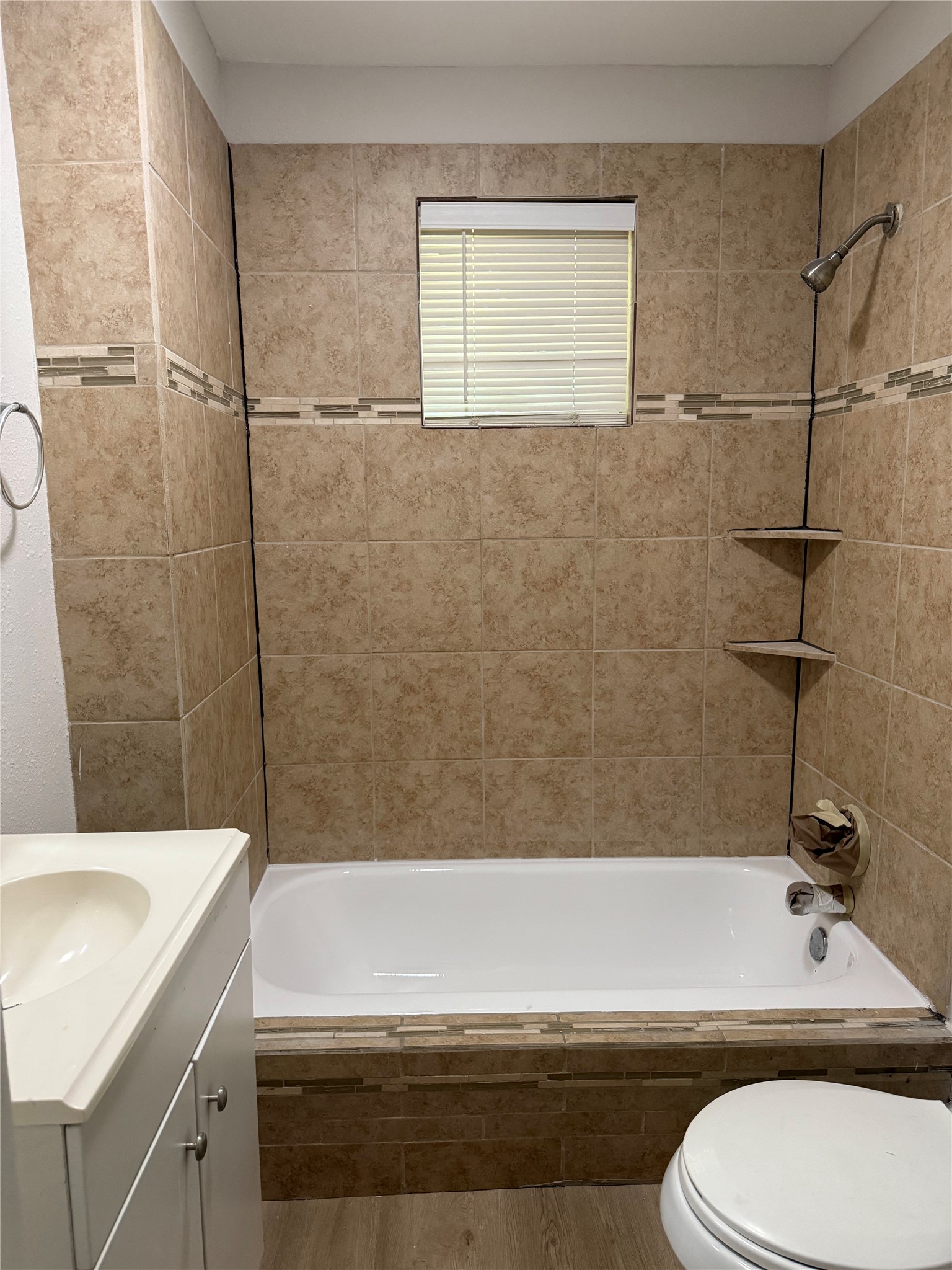 320 Delaware Street Houston, TX 77029 - Photo 9 of 10 a bathroom with a sink a toilet and shower