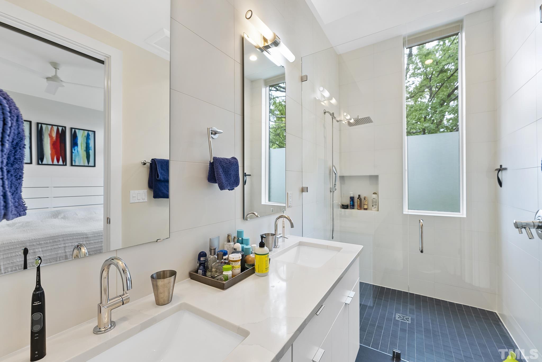 2323 Clark Avenue Raleigh, NC 27607 - Photo 14 of 33 a bathroom with a tub sink and mirror