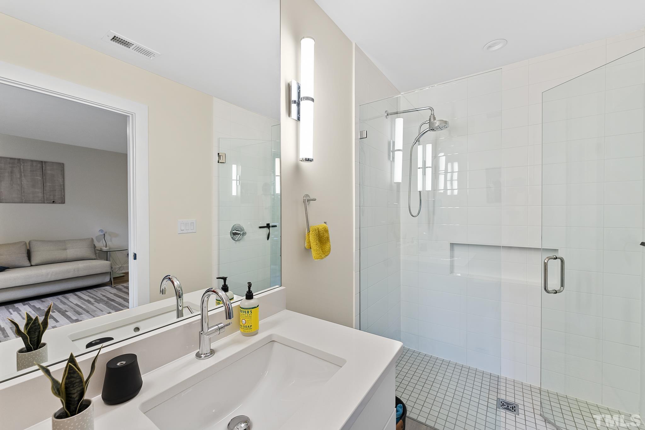 2323 Clark Avenue Raleigh, NC 27607 - Photo 24 of 33 a bathroom with a sink and a shower