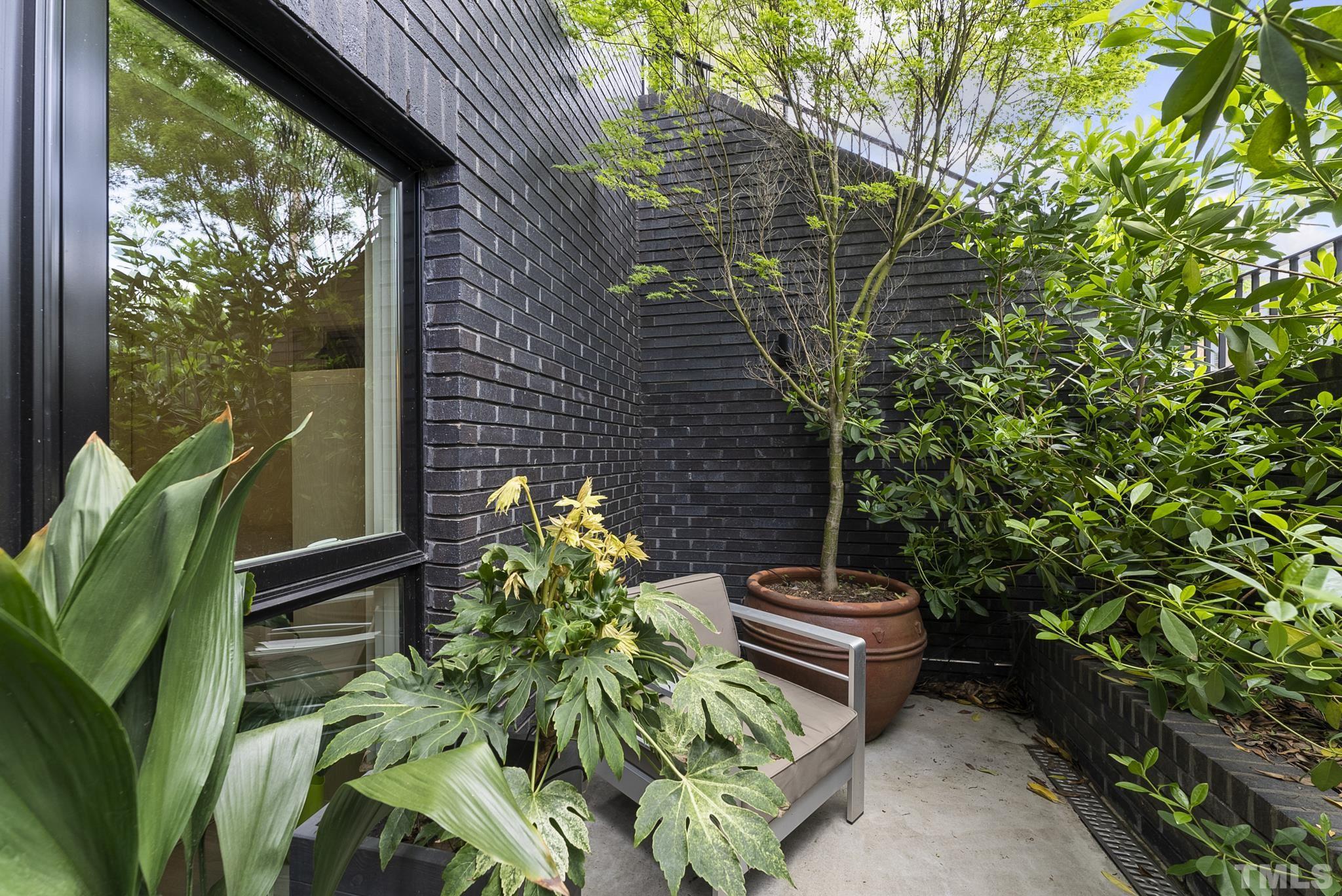 2323 Clark Avenue Raleigh, NC 27607 - Photo 29 of 33 a backyard of a house with lots of green space
