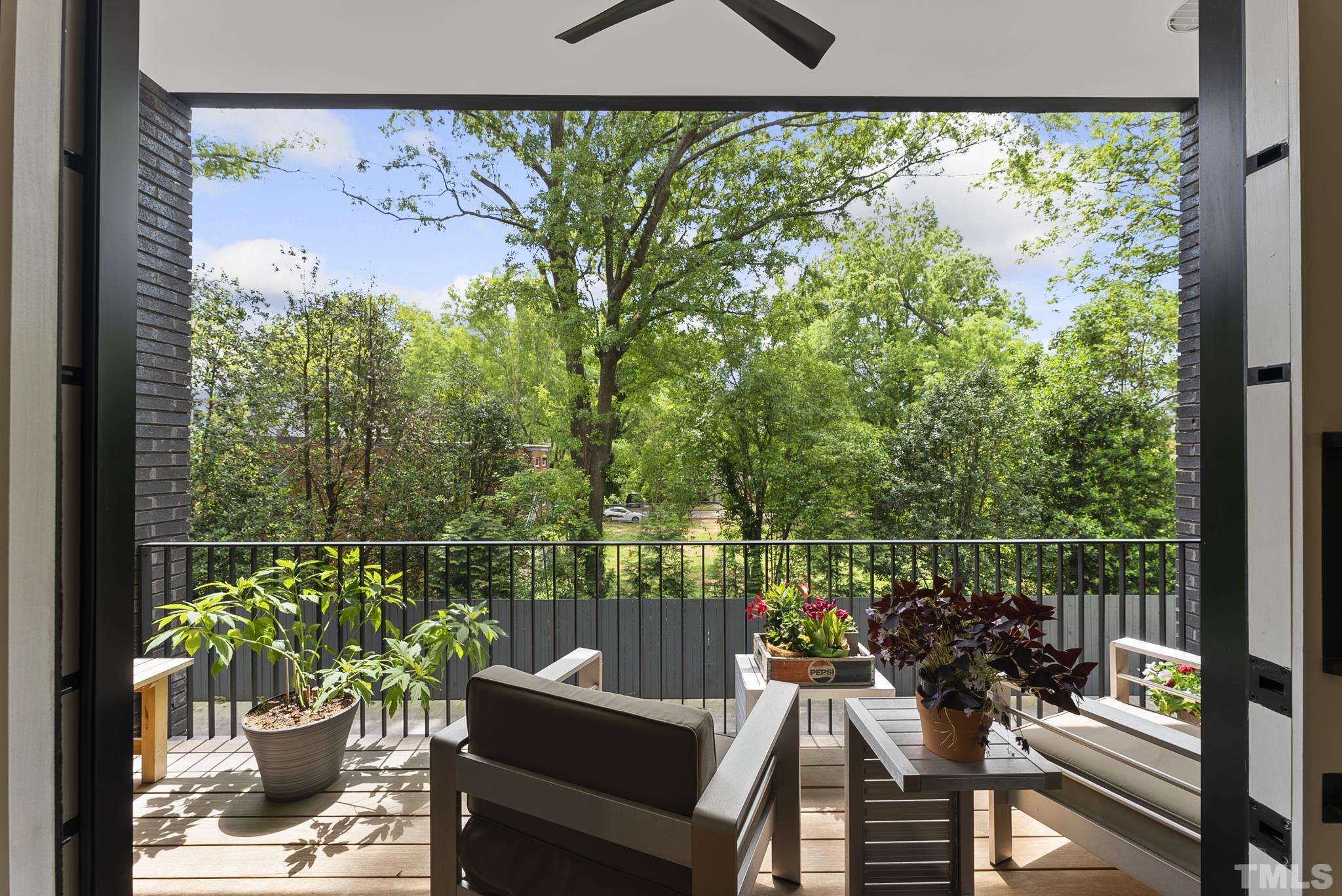 2323 Clark Avenue Raleigh, NC 27607 - Photo 10 of 33 a view of a balcony with chairs and a potted plant